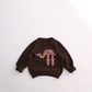 Brown cotton knit kids sweater with pink flamingo motif, ribbed neck and cuffs, for height 80cm