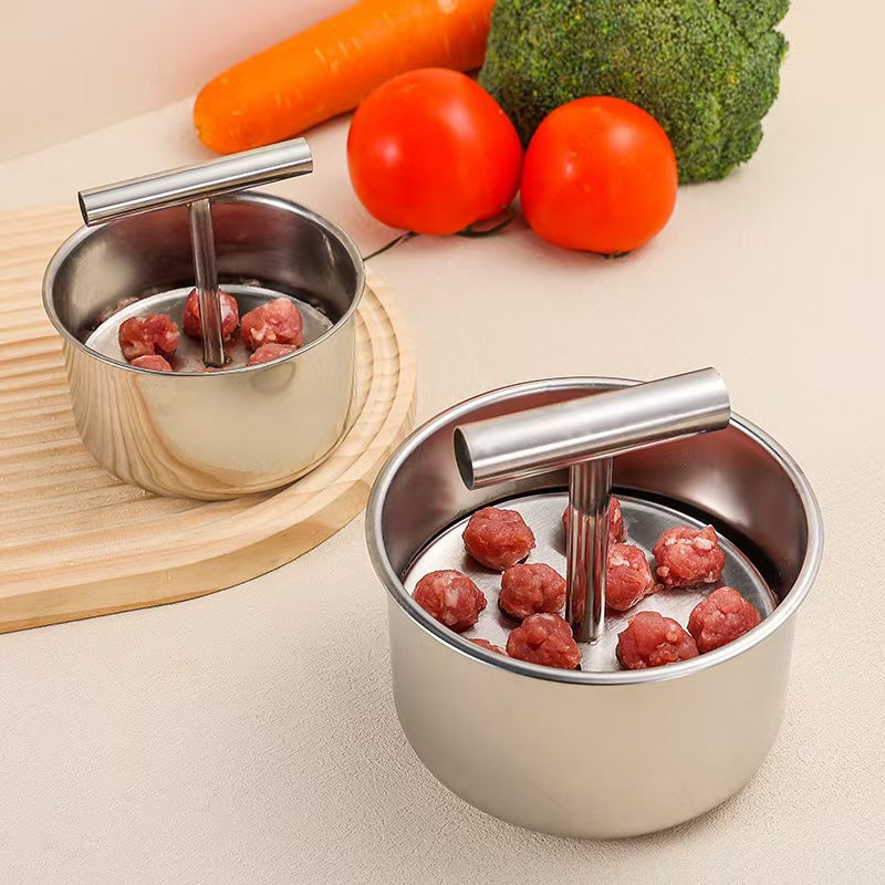 Large twelve hole meatball press shaping even meatballs in a stainless steel drum