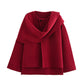 Red knitted coat with a draped scarf collar and flared hem