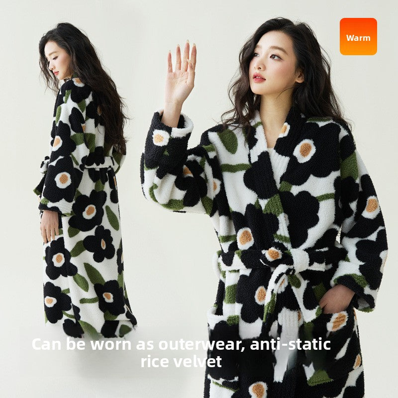 Two women in a black and white large flower print fleece robe with a belt, with text on wearing it as outerwear