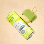 Compact reusable washable lint remover with a rolling drum and a loop handle in green
