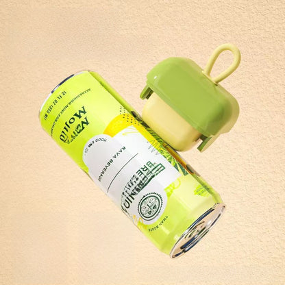Compact reusable washable lint remover with a rolling drum and a loop handle in green