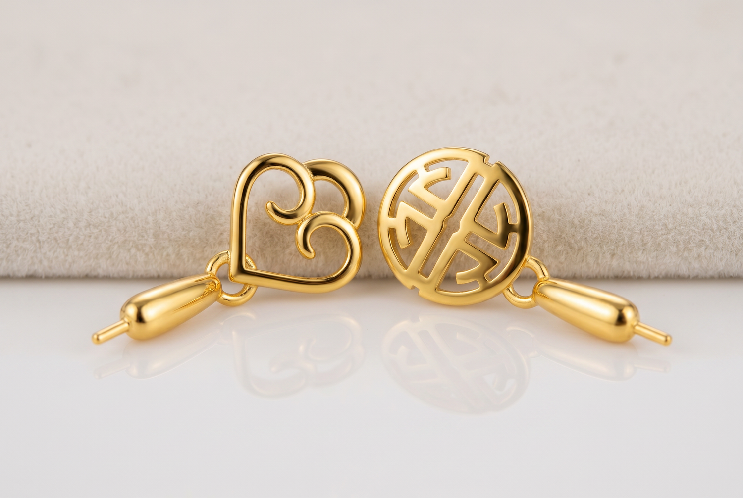 Macro of the real gold-tone openwork heart and round motif findings