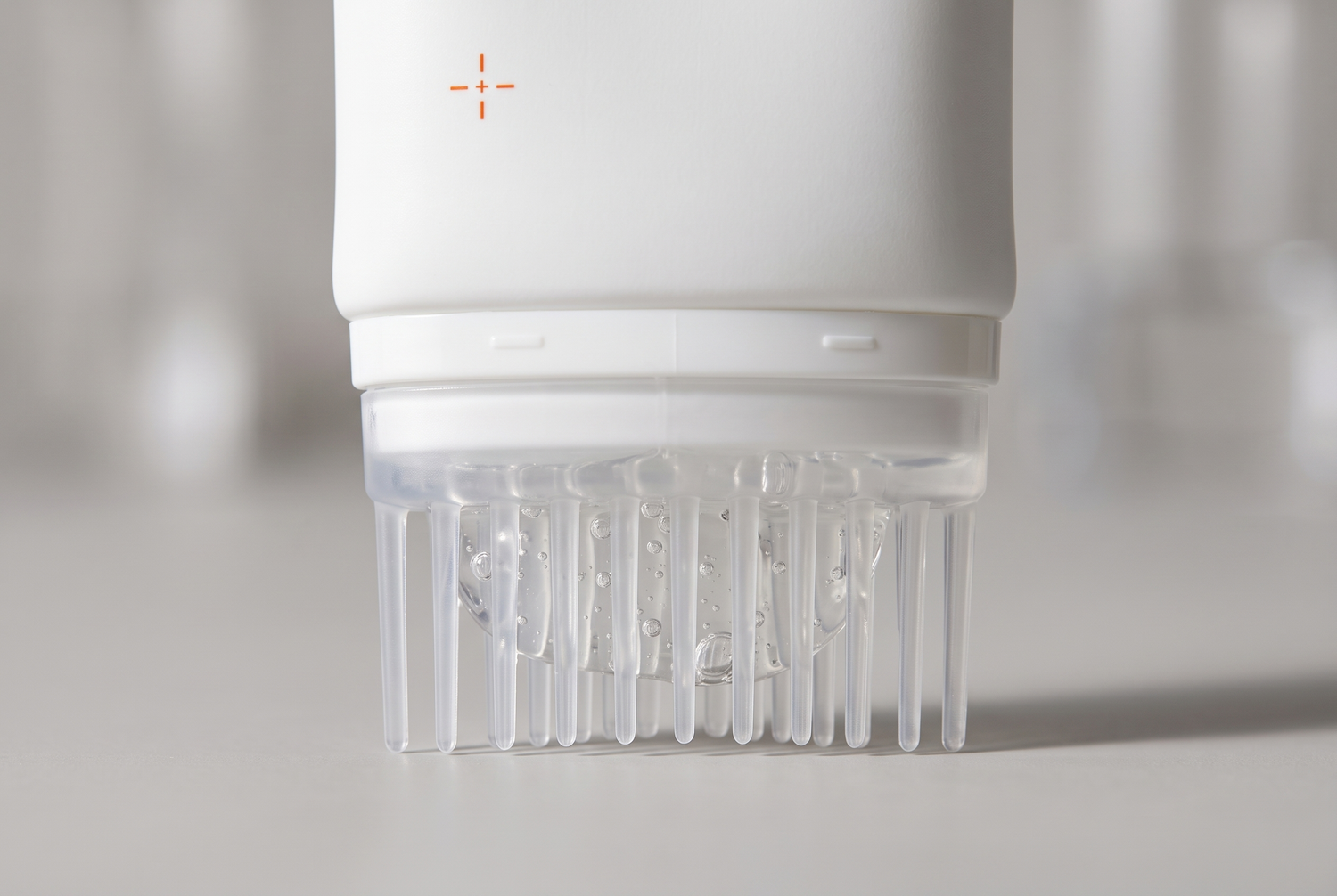 hair-care-essence-with-scalp-massager functional close up