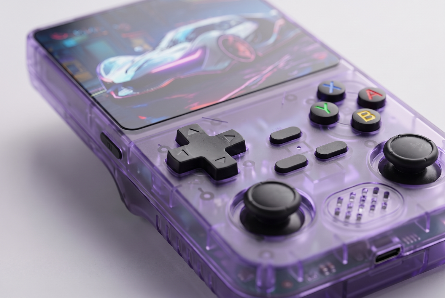 Close up of the translucent purple handheld game console showing screen buttons and analog sticks