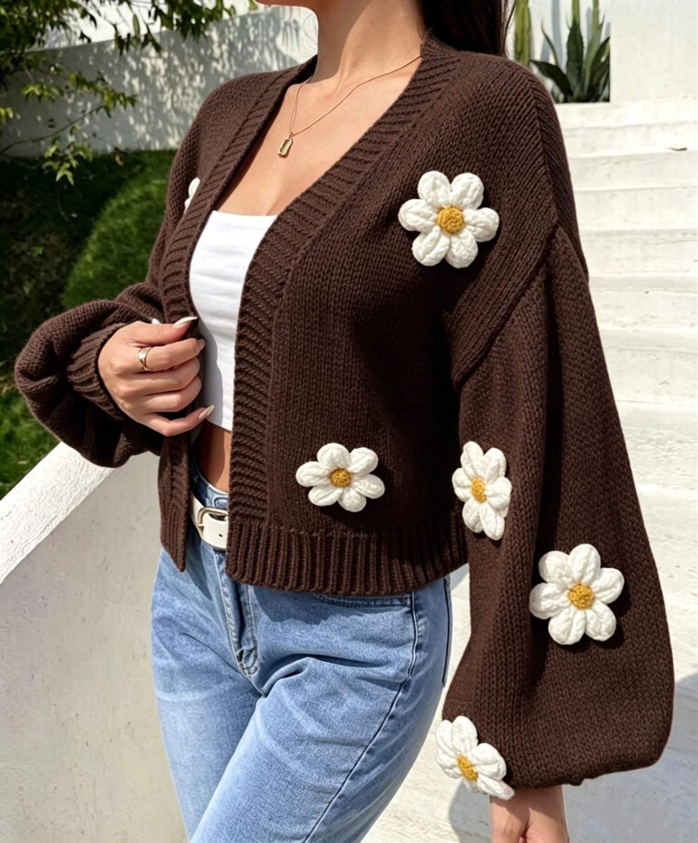 Lantern sleeve of the floral knit cardigan gathered into a ribbed cuff