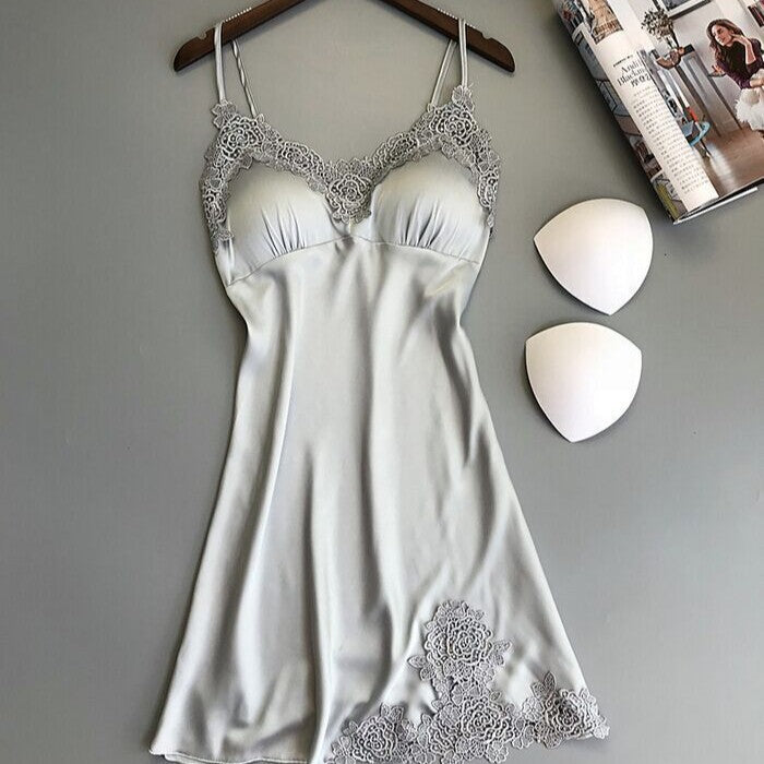 Ice silk lace cami nightgown in silver gray on a hanger with removable triangle bust pads beside it, angled view