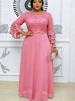 Floor length floral lace chiffon dress with tiered ruffle sleeves on a model
