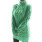Green chunky cable knit turtleneck sweater dress on a model, three quarter front view