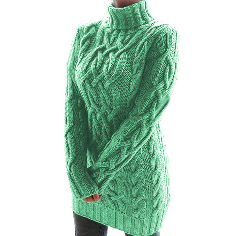 Green chunky cable knit turtleneck sweater dress on a model, three quarter front view