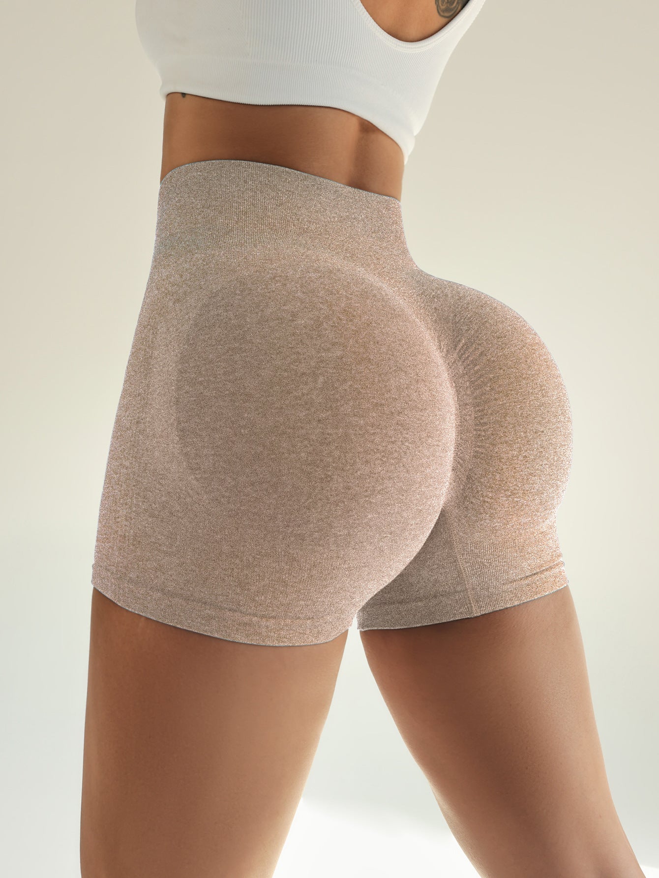 Side view of the marled sand khaki ribbed shorts with the rounded knitted seat panel