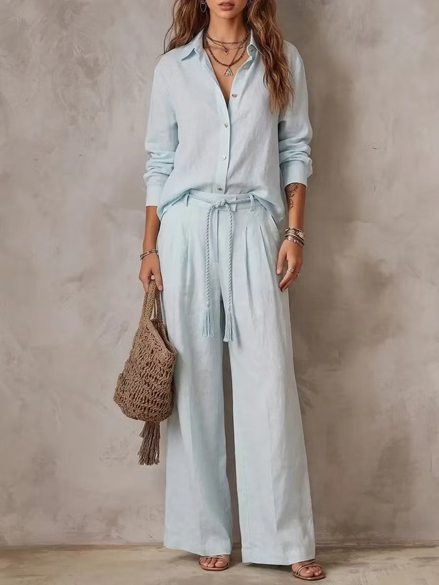 Sky blue long sleeve button shirt with matching high waist wide leg pants, front view