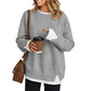 Relaxed pink crewneck sweatshirt with long sleeves and a ribbed collar