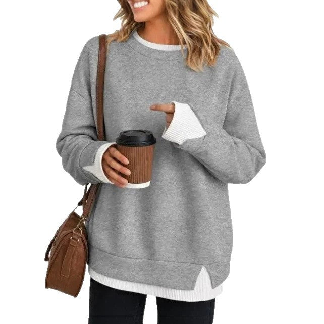 Relaxed pink crewneck sweatshirt with long sleeves and a ribbed collar