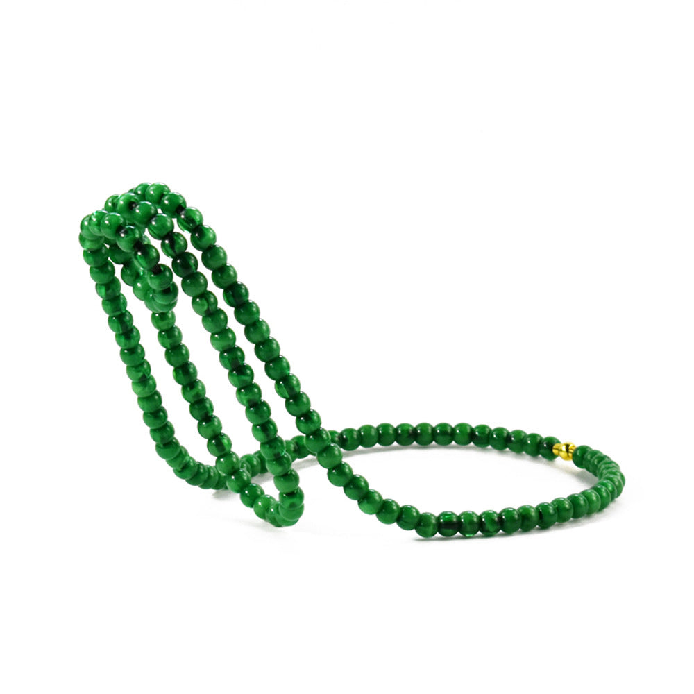 Green beaded wine bottle holder on a white background, Green option
