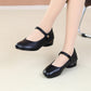 Mary Jane shoe paired with sheer tights wool dress