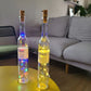 Lit glass bottles with copper wire string lights
