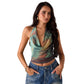 Sleeveless geometric print blouse styled in a modern interior