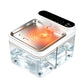 Pet water fountain with a stainless steel bowl lit by orange heating rings above a clear water tank