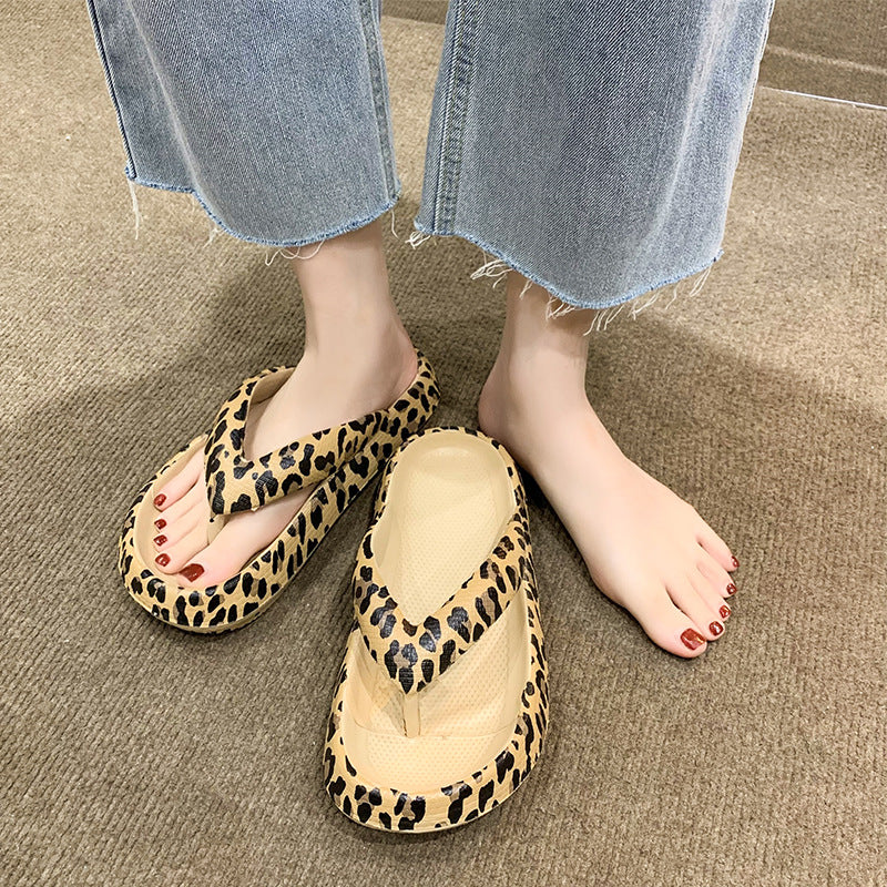 Pair of soft EVA flip flops with a high cushioned platform and grippy footbed