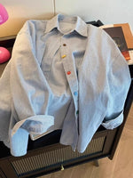 Blue striped long sleeve cotton shirt, front view with full button placket