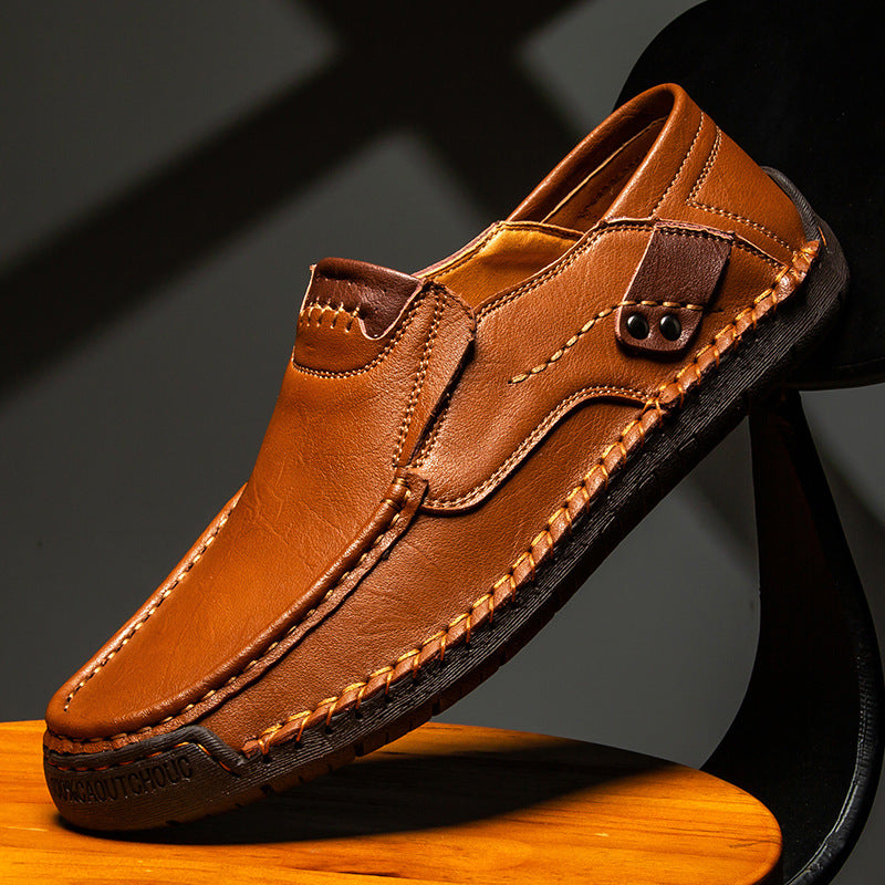 Rubber sole and low heel of a mens cowhide leather slip on loafer