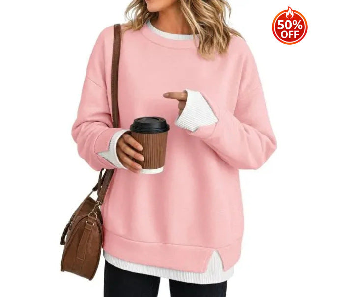 Navy women's sweatshirt showing the split hem and contrast white rib detail