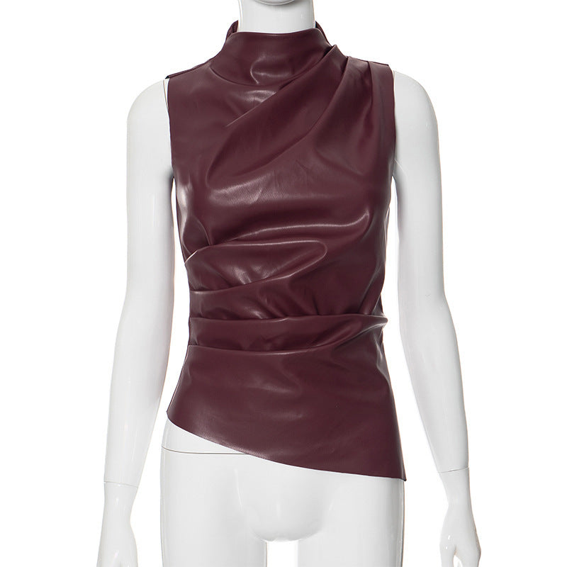 Sleeveless faux leather top styled with cargo trousers for an evening look