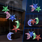 Star and moon LED figures glowing in several colors, hanging from a solar lamp head, red housing option