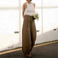 Cotton linen wide leg trousers showing front pleats and side seam pocket detail