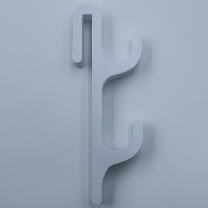 White resin single sided double hook with two arms stacked, seen from the front on a light background