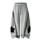 Star patch drawstring pants worn in a relaxed casual daytime outfit