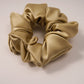 Elegant gray satin scrunchie shown close up