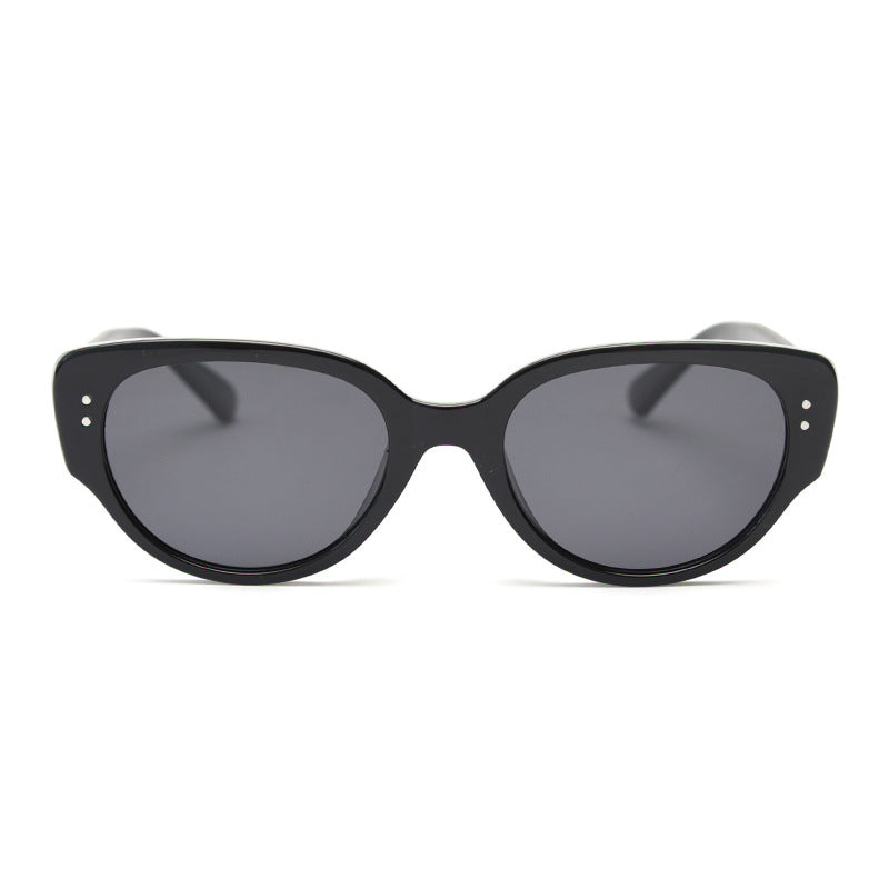 Black oval cat eye TR90 frame with dark tinted lenses shown from the front