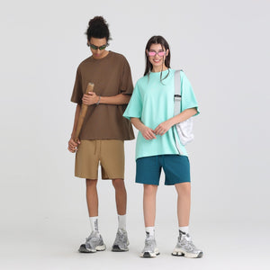 Heavyweight cotton oversized crew neck short sleeve tee in a solid color on a plain background