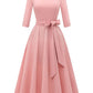 Three quarter sleeve swing dress with fitted bodice and tie bow belt at the waist
