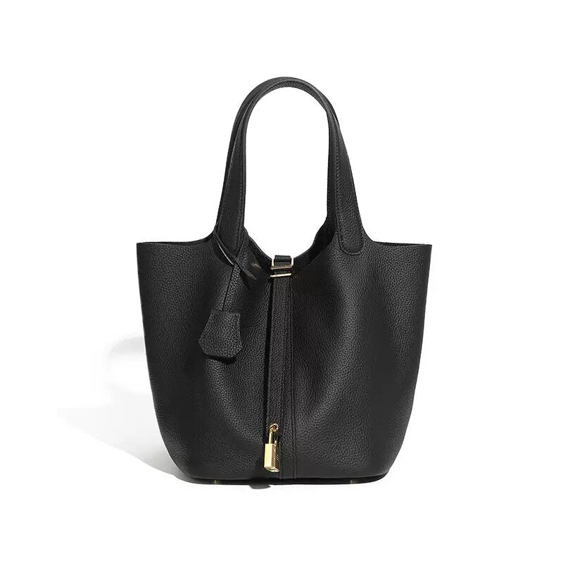 Leather bucket tote bag laid flat in an overview shot