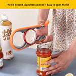 Orange four in one opener gripping a jar lid above an open jar