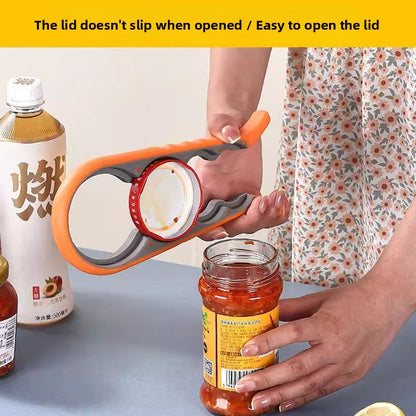 Orange four in one opener gripping a jar lid above an open jar