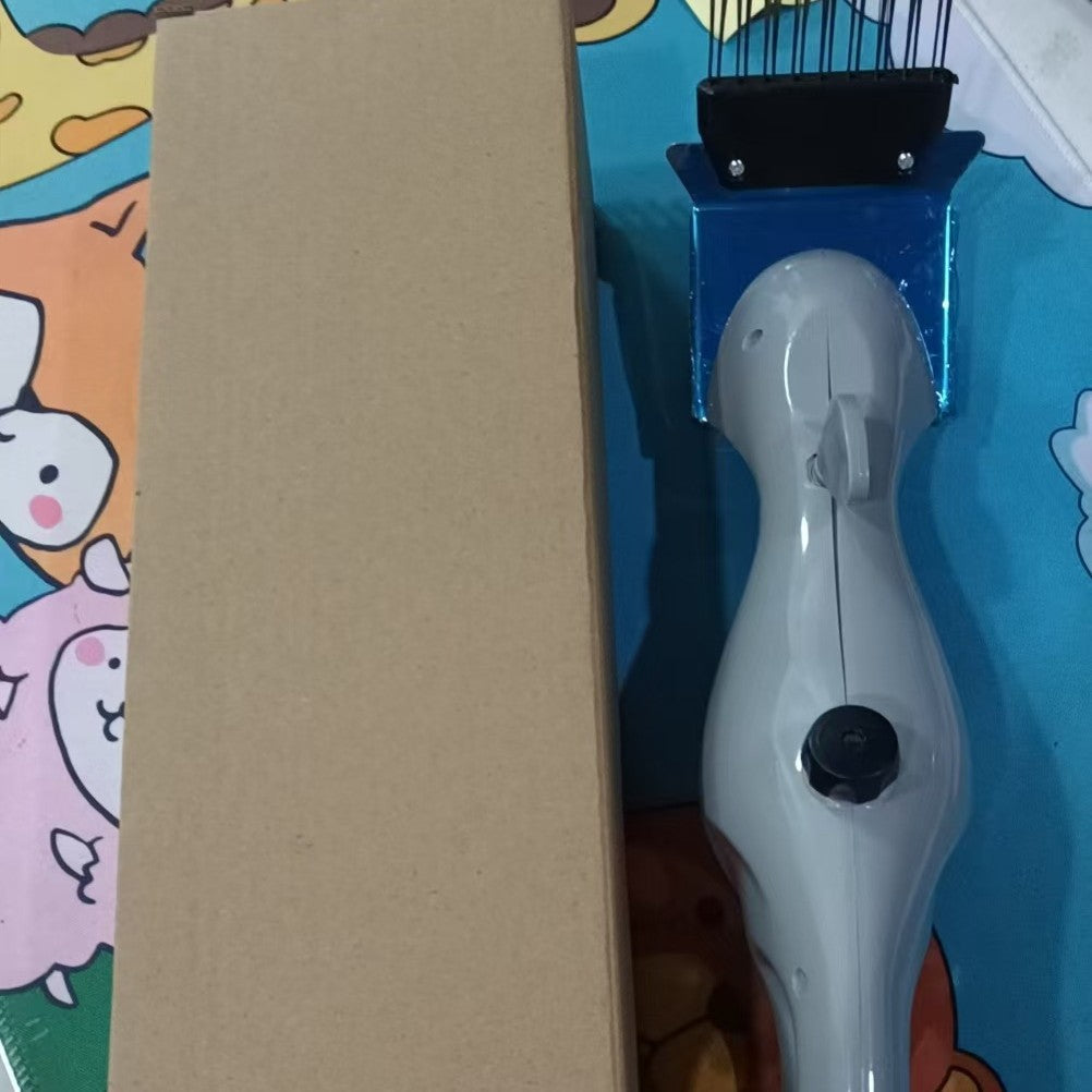 Grill brush shown beside its packing box, blue and white handle with black steel bristle cleaning head