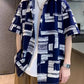 Print shirt worn open, sleeves finishing near the elbow on a wide straight body