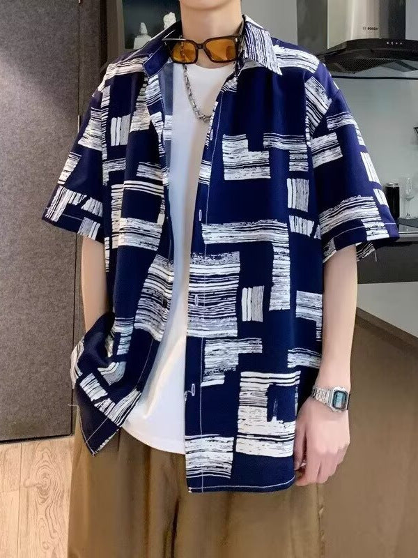 Print shirt worn open, sleeves finishing near the elbow on a wide straight body
