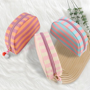 Canvas check toiletry bag shown from the front with woven stripe pattern