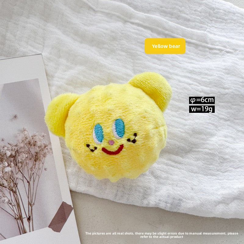 Soft corn velvet and plush squeaky pet toy shaped like a cartoon animal on a plain background