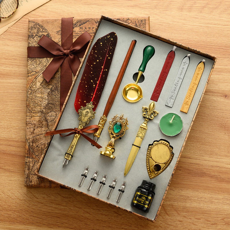 European style feather dip pen with a stainless steel nib, gold flecked resin barrel and ornate gold tone grip