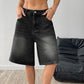Women's denim wide-leg shorts in deep black on a clean studio background