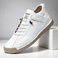 Pair of hand-stitched casual shoes with a stitched welt sole