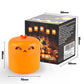 Orange pumpkin LED night light on white with size markings beside its black Halloween gift box