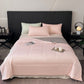 Summer coverlet spread over a mattress, large box quilting keeping the fill evenly spread