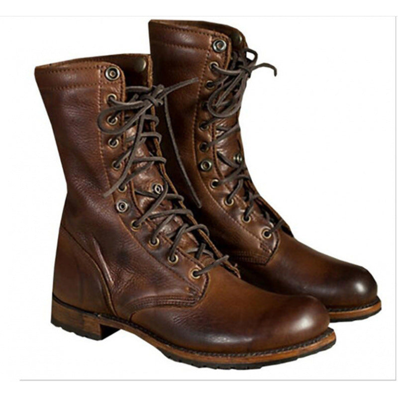 Pair of brown lace-up boots with front lacing and a stitched vamp, gallery style photo, not an option